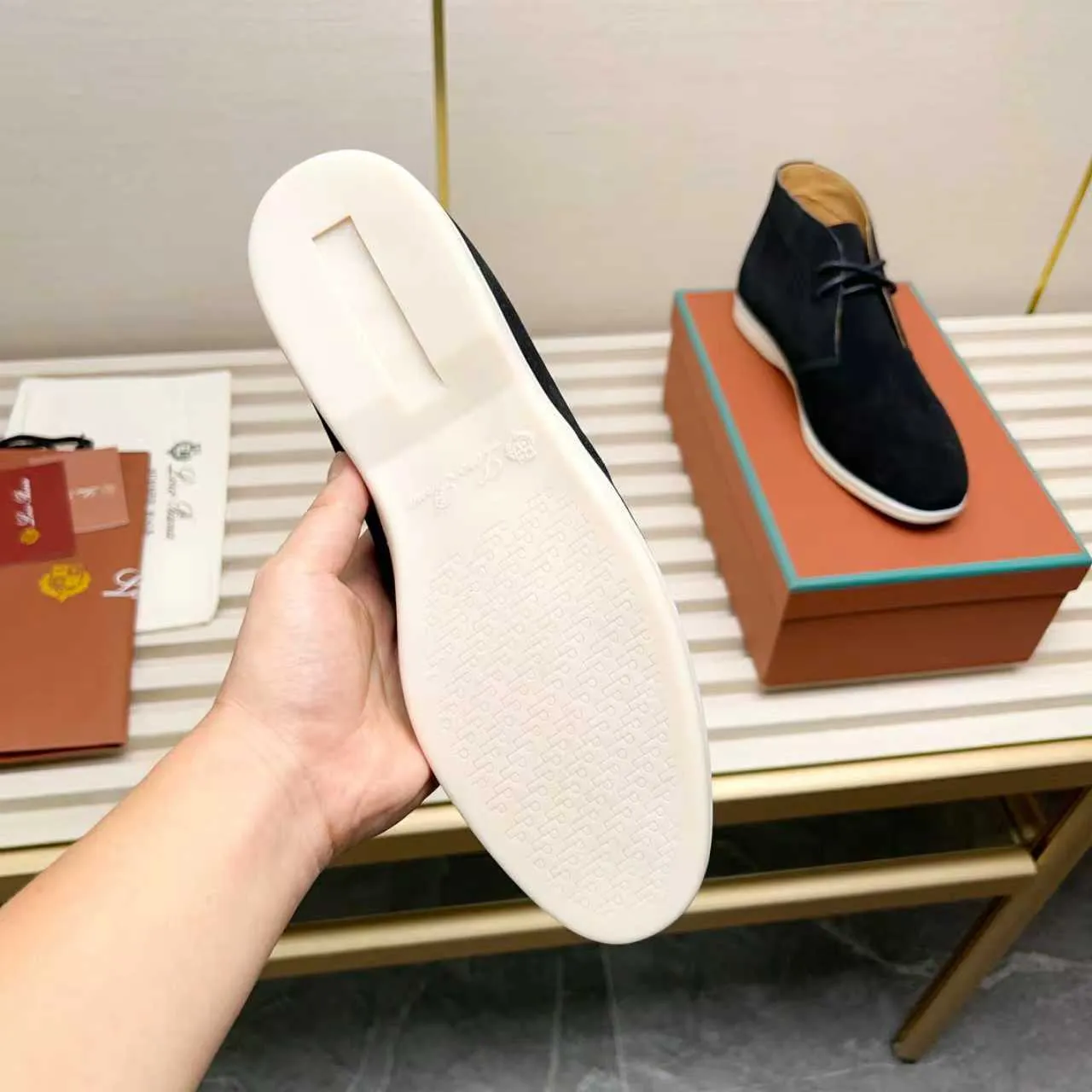 Men's Shoes 💰420 Loro Piana reimagines the desert boot—a modern, comfortable interpretation of a classic 1940s style. Crafted from suede calfskin, it exudes elegance. The tight texture of suede calfskin is not only durable but also looks casual and sophisticated. Add a timeless piece to your shoe collection, harmoniously blending comfort, style and Loro Piana's heritage of craftsmanship. Acetate satin detail on the inside White sole with LP lettering for added traction Space for a personalized signature on the heel Tonal suede trim Upper: 100% cow split suede Sole: 100% Rubber lining: Cow leather